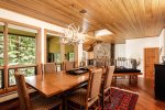 Renovated, large gourmet kitchen is well-stocked and leads into the dining area seating eight comfortably, and overlooking the mountains
